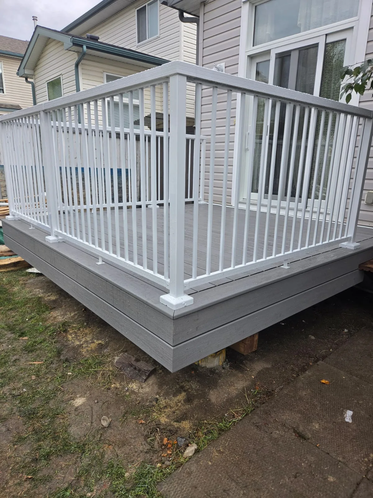 Completed grey deck with white railings